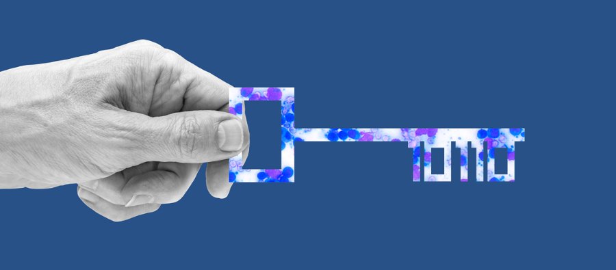Hand holding a key made of cytology imagery, with binary-code teeth
